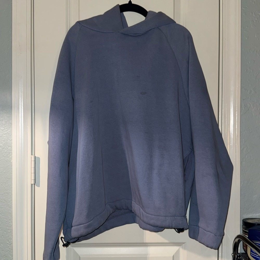 Blue cropped hoodie with adjustable draw string
